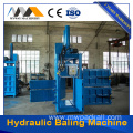 Hydraulic baling machine with pressure